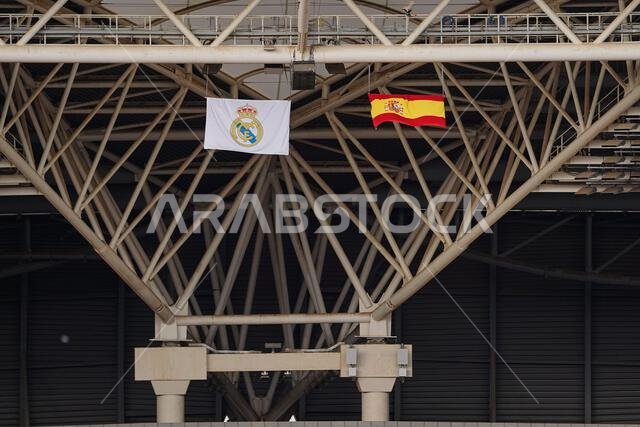 A general view from inside shows flags of Spain (R) and Real Madrid (L) in the King Abdullah Sports City stadium ahead of the Spanish Super Cup final match El Clasico between FC Barcelona and Real Madrid.