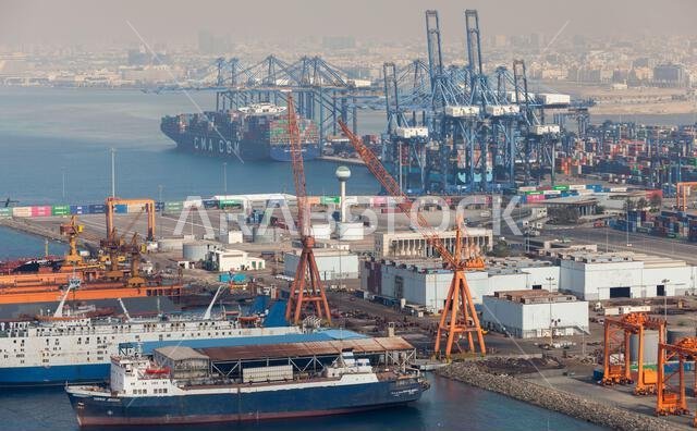 Jeddah, Saudi Arabia - December 22, 2019: Jeddah port on a daytime, aerial view with cargo ships, containers and dry docks