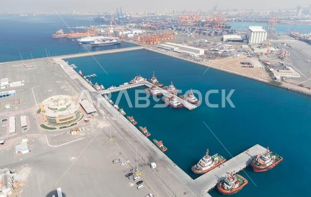 Jeddah, Saudi Arabia - December 22, 2019: Jeddah Islamic Seaport aerial view with moored tugs and pilot boats
