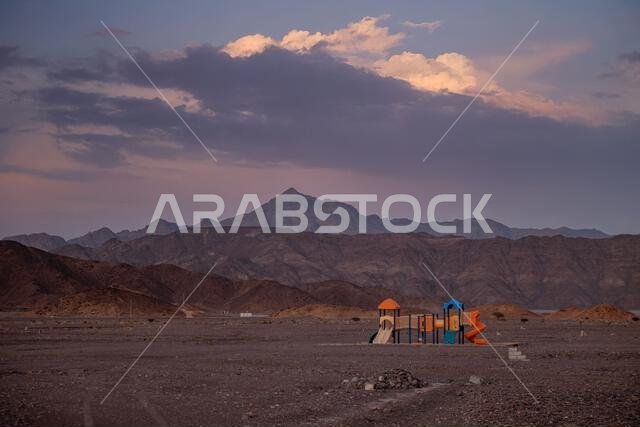 Playground in a Barren Desert Surreal Landscape at Dusk