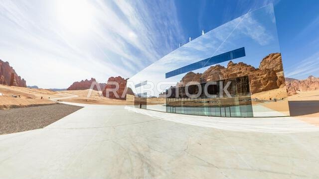 Hegra, Al-Ula, Saudi Arabia,Jan 5, 2025:mirrored facade of Maraya Concert Hall reflects majestic sandstone mountains of Ashar Valley in Alula