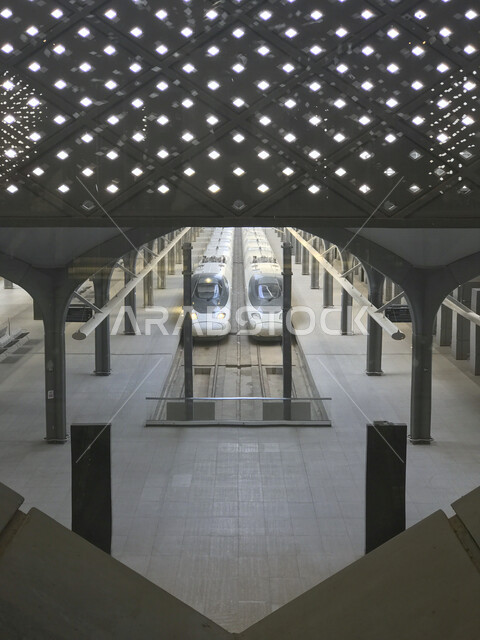 Aesthetic image inside the high-speed train station in Madinah, a high-speed train station for transporting pilgrims from Madinah to Makkah Al-Mukarramah, safe and fast transportation services for pilgrims during the Hajj season