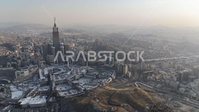 Mecca , Saudi Arabia Mars 30 2024: Makkah city Streets hotels and transportation Makkah Clock Tower - Masjid Al Haram drone aerial view