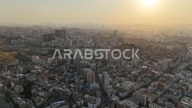 Mecca , Saudi Arabia Mars 30 2024: Makkah city Streets hotels and transportation Makkah Clock Tower - Masjid Al Haram drone aerial view