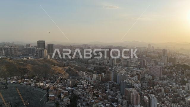 Mecca , Saudi Arabia Mars 30 2024: Makkah city Streets hotels and transportation Makkah Clock Tower - Masjid Al Haram drone aerial view