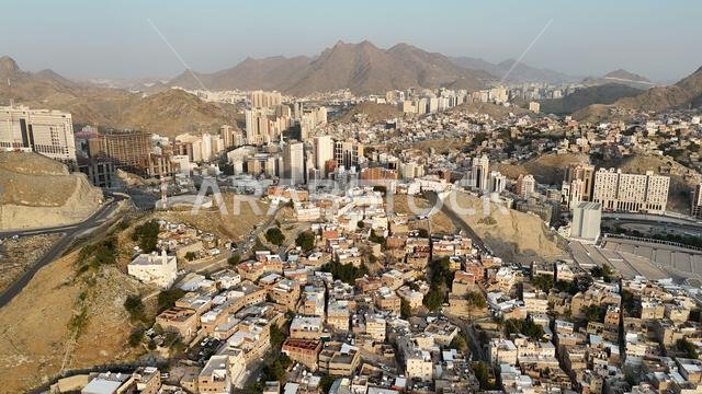 Mecca , Saudi Arabia Mars 30 2024: Makkah city Streets hotels and transportation Makkah Clock Tower - Masjid Al Haram drone aerial view