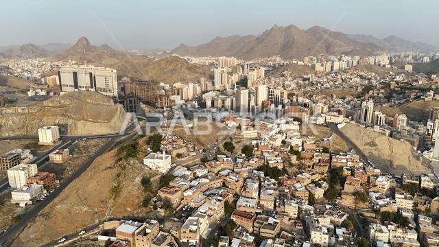 Mecca , Saudi Arabia Mars 30 2024: Makkah city Streets hotels and transportation Makkah Clock Tower - Masjid Al Haram drone aerial view
