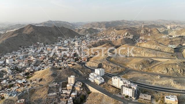 Mecca , Saudi Arabia Mars 30 2024: Makkah city Streets hotels and transportation Makkah Clock Tower - Masjid Al Haram drone aerial view