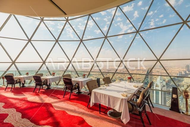 Riyadh , Saudi Arabia - Jannuary 8, 2025: Luxurious the Globe sky-bar restaurant with large windows offering a breathtaking view of Riyadh skyline