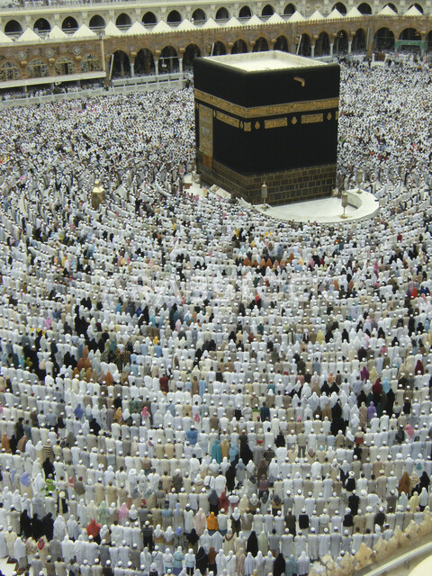 An aesthetic image of the Kaaba in Mecca, pilgrims of the House of God in Ihram clothes, performing Hajj and Umrah, worship and getting closer to God, Islamic religious landmarks in the Kingdom of Saudi Arabia