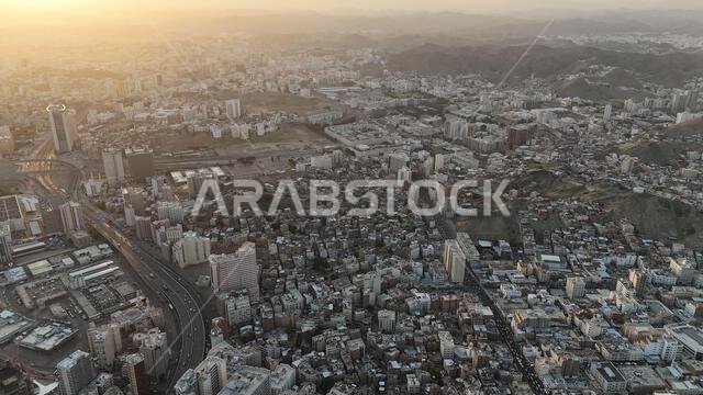 Mecca , Saudi Arabia Mars 30 2024: Makkah city Streets hotels and transportation Makkah Clock Tower - Masjid Al Haram drone aerial view