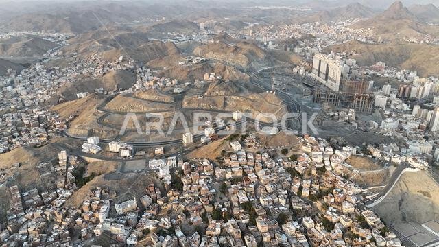 Mecca , Saudi Arabia Mars 30 2024: Makkah city Streets hotels and transportation Makkah Clock Tower - Masjid Al Haram drone aerial view