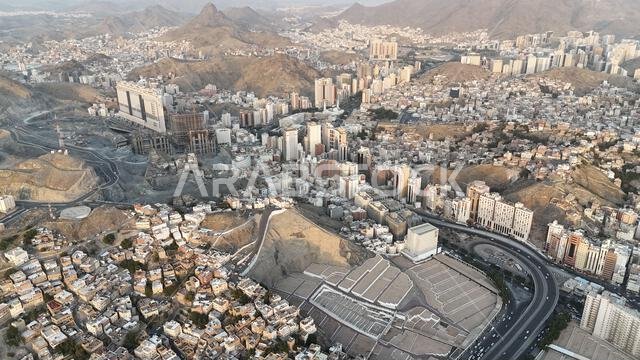 Mecca , Saudi Arabia Mars 30 2024: Makkah city Streets hotels and transportation Makkah Clock Tower - Masjid Al Haram drone aerial view