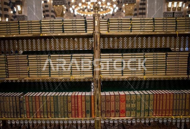 Medina, Saudi Arabia - July 5, 2024: Al-Quran rows lined up neatly in Masjid Nabawi, Prophet Mosque, Medina, Saudia Arabia. Medina, Saudi Arabia - July 5, 2024: Al-Quran rows lined up neatly in Masjid Nabawi, Prophet Mosque, Medina, Saudia Arabia.