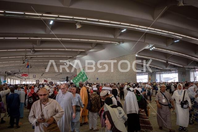 Mecca, Saudi Arabia - June 18, 2024: Pilgrims doing the Jamarat stoning ritual in Mina, Saudi Arabia in the Hajj season.