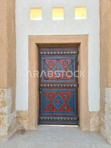 Vertical Close-Up of a Traditional Ornate Painted Door in Riyadh, Saudi Arabia