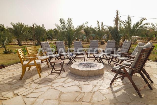 Outdoor Fire Pit Lounge in a Palm Oasis. Saudi Arabia.