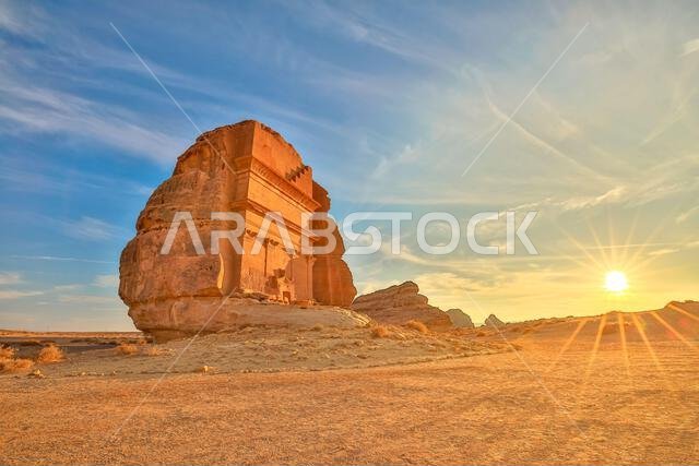 The majestic Qasr Al Farid, also known as the tomb of Lihyan son of Kuza, stands tall in the Hegra desert of AlUla, Saudi Arabia, bathed in the warm
