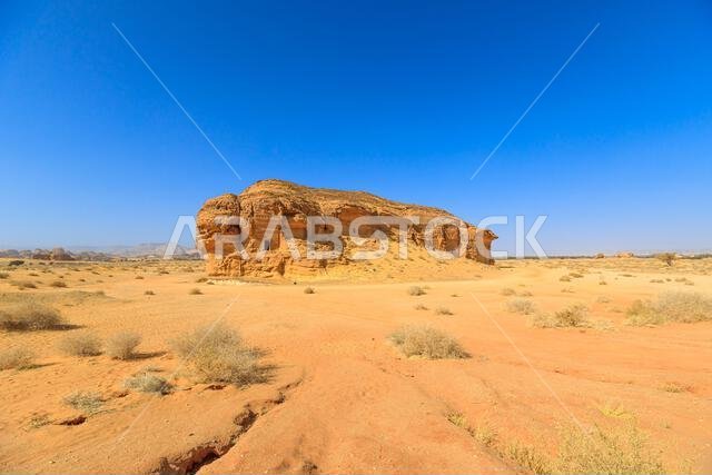 Sandstone tombs Jabal Al-Ahmar carved a rocks in Hegra, Madain Salih of Saudi Arabia, highlight the unique architecture and historical significance of