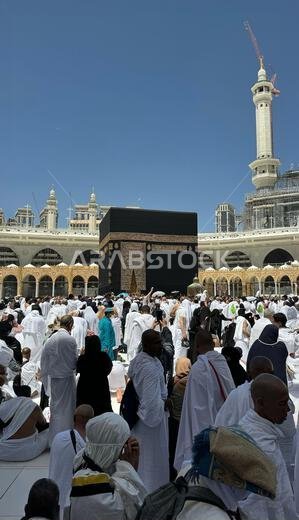 Muslim pilgrims perform Tawaf around the Kaaba after dawn prayer at Masjid al-Haram in Makkah. Translation: Praise be to Allah Who created the heavens