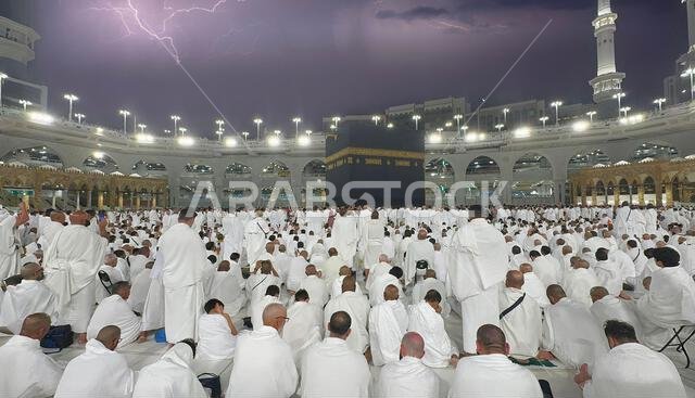 Muslim pilgrims perform Tawaf around the Kaaba after dawn prayer at Masjid al-Haram in Makkah. Translation: Praise be to Allah Who created the heavens