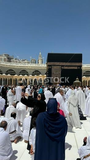 Muslim pilgrims perform Tawaf around the Kaaba after dawn prayer at Masjid al-Haram in Makkah. Translation: Praise be to Allah Who created the heavens