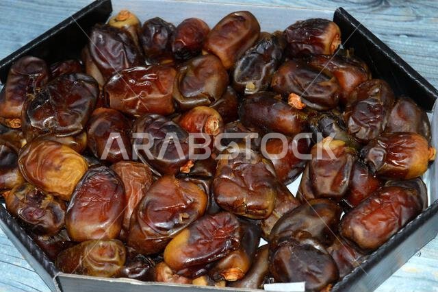 Ajwa dates, a cultivar of the palm date that is widely grown in Medina, Saudi Arabia., an oval-shaped, medium-sized date, often consumed Iftar for Ram