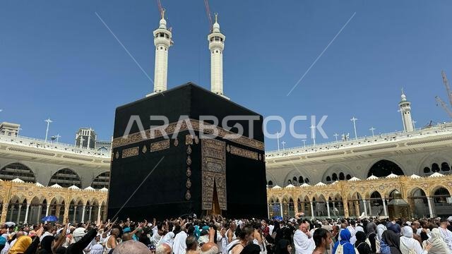 Muslim pilgrims perform Tawaf around the Kaaba after dawn prayer at Masjid al-Haram in Makkah. Translation: Praise be to Allah Who created the heavens