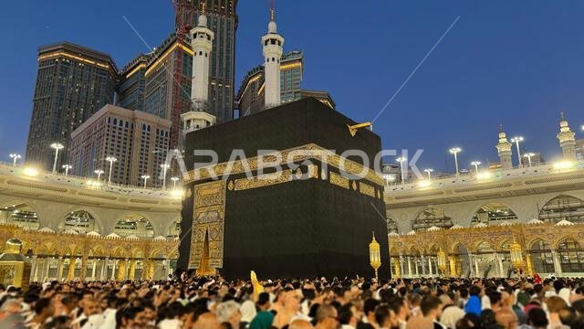 Muslim pilgrims perform Tawaf around the Kaaba after dawn prayer at Masjid al-Haram in Makkah. Translation: Praise be to Allah Who created the heavens