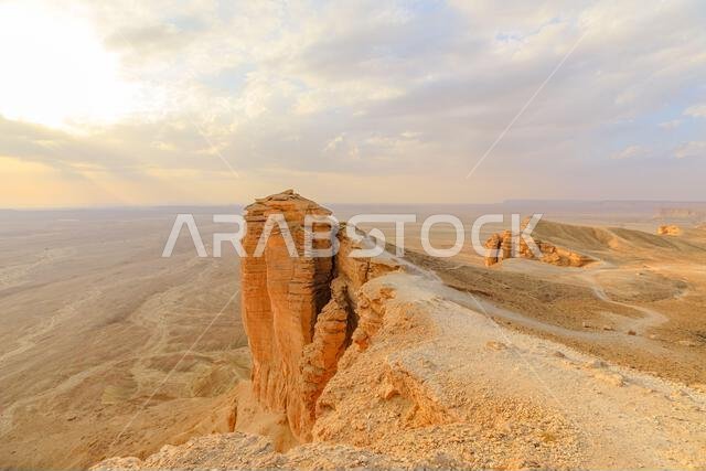 Golden hour sunlight illuminates the Tuwaiq escarpment at sunset, casting long shadows across the desert landscape near Riyadh, Saudi Arabia, a Golden hour sunlight illuminates the Tuwaiq escarpment at sunset, casting long shadows across the desert landscape near Riyadh, Saudi Arabia, a