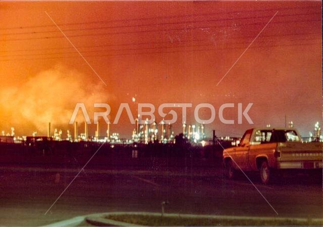 Aramco Plant with orange sky, Abqaiq, Saudi Arabia, 1970s-1980s Aramco Plant with orange sky, Abqaiq, Saudi Arabia, 1970s-1980s
