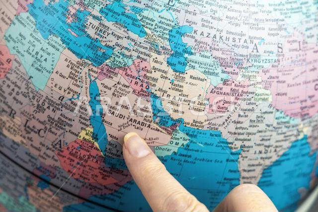 Close-up view of Globe pointing at Saudi Arabia in Middle East. Copenhagen, Denmark - March 6, 2025