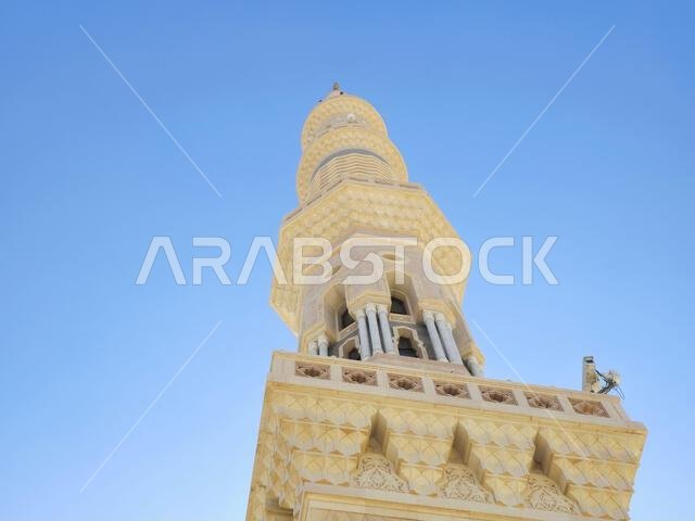 A high minaret of The Prophet's Mosque or Al Masjid Al Nabawi, major site of pilgrimage in Madinah city that falls under the purview of the Custodian A high minaret of The Prophet's Mosque or Al Masjid Al Nabawi, major site of pilgrimage in Madinah city that falls under the purview of the Custodian