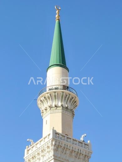 The green topped minaret of The Prophet's Mosque or Al Masjid Al Nabawi, major site of pilgrimage in Madinah city that falls under the purview of the