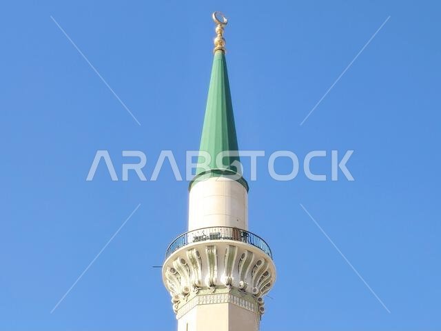 The green topped minaret of The Prophet's Mosque or Al Masjid Al Nabawi, major site of pilgrimage in Madinah city that falls under the purview of the