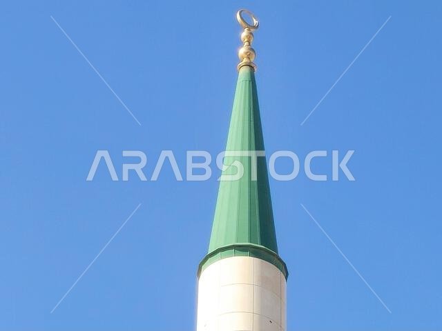 The green topped minaret of The Prophet's Mosque or Al Masjid Al Nabawi, major site of pilgrimage in Madinah city that falls under the purview of the
