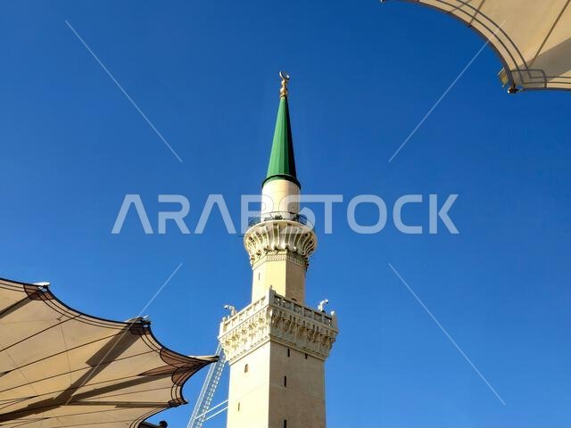 The green topped minaret of The Prophet's Mosque or Al Masjid Al Nabawi, major site of pilgrimage in Madinah city that falls under the purview of the