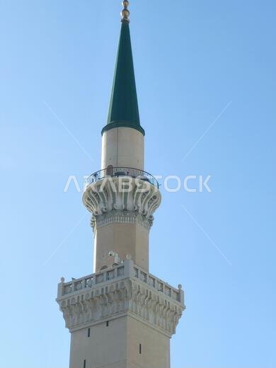 The green topped minaret of The Prophet's Mosque or Al Masjid Al Nabawi, major site of pilgrimage in Madinah city that falls under the purview of the