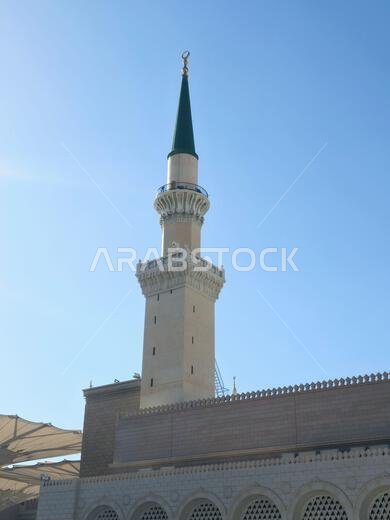 The green topped minaret of The Prophet's Mosque or Al Masjid Al Nabawi, major site of pilgrimage in Madinah city that falls under the purview of the