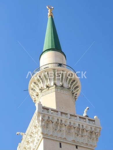 المئذنة الخضراء للمسجد النبوي، وهو موقع رئيسي للحج في المدينة المنورة يقع ضمن نطاق...
