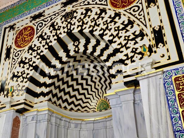 The Mihrab Niche in the prophet mosque near Al Rawdah and the grave of the prophet Muhammad peace be upon him, Inside the prophet's mosque, with Arabi