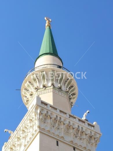 The green topped minaret of The Prophet's Mosque or Al Masjid Al Nabawi, major site of pilgrimage in Madinah city that falls under the purview of the