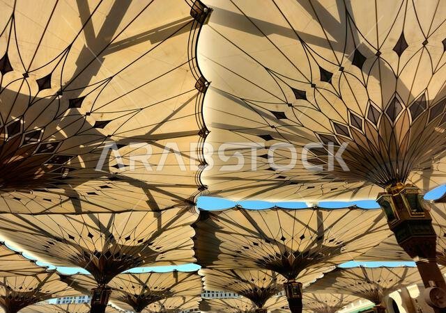 The tents at the prophet's mosque or Al Masjid Al Nabawi in Madinah at the outer courtyard to provide shade to pilgrims, a major site of pilgrimage, T