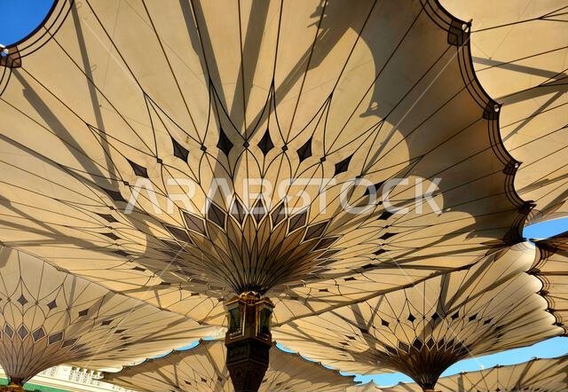 The tents at the prophet's mosque or Al Masjid Al Nabawi in Madinah at the outer courtyard to provide shade to pilgrims, a major site of pilgrimage, T
