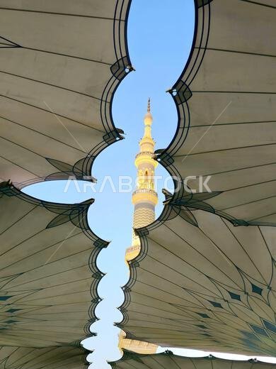 Minaret through the tents in the outside of The Prophet's Mosque or Al Masjid Al Nabawi, a major site of pilgrimage that falls under the purview of th