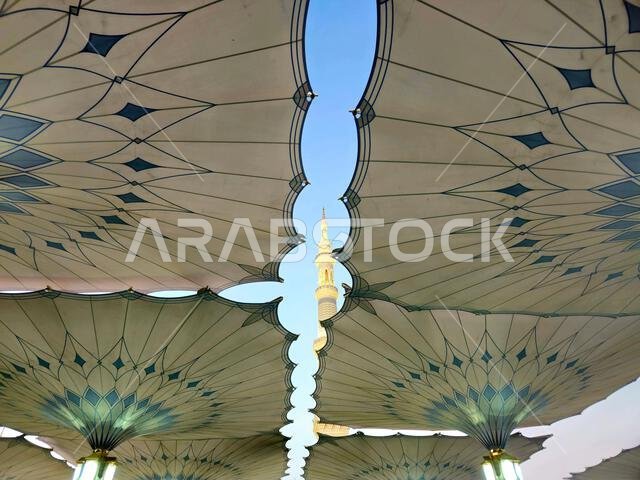 Minaret through the tents in the outside of The Prophet's Mosque or Al Masjid Al Nabawi, a major site of pilgrimage that falls under the purview of th