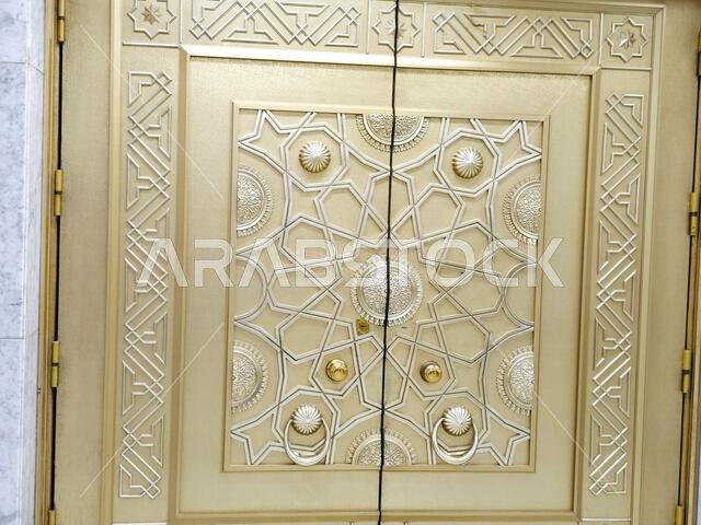 The golden door from the Sacred grand mosque of Makkah, the Sacred mosque is the most significant mosque in Islam, encloses vicinity of the Kaaba, amo