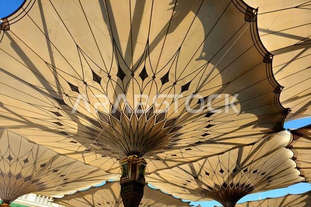 The tents at the prophet's mosque or Al Masjid Al Nabawi in Madinah at the outer courtyard to provide shade to pilgrims, a major site of pilgrimage, T