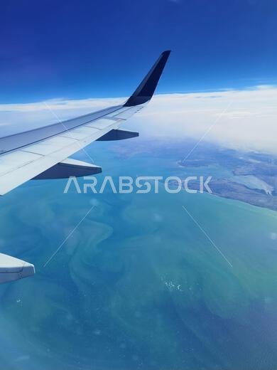 Airplane's wing. Amazing view flying over Persian gulf Airplane's wing. Amazing view flying over Persian gulf