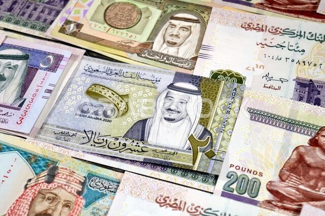 Saudi Arabia riyals SAR cash money bills banknotes and Piles of Egypt money thousands of Pounds currency banknotes bills of 200 EGP LE, Egyptian money Saudi Arabia riyals SAR cash money bills banknotes and Piles of Egypt money thousands of Pounds currency banknotes bills of 200 EGP LE, Egyptian money